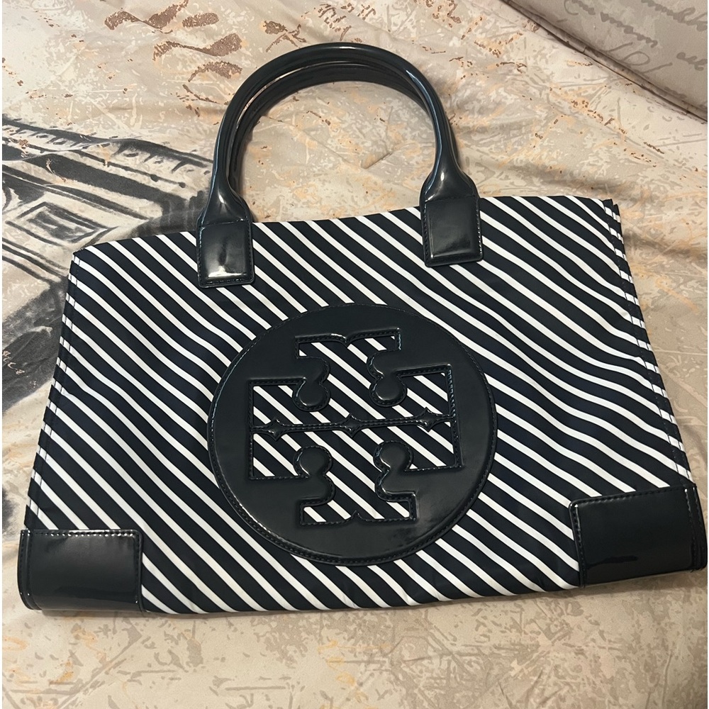 Tory Burch Navy Blue and White stripped purse.